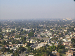 A smog cloud over south Los Angeles, near the city of Compton. A historically African-American and Latino community, Compton is surrounded on all four sides by major highways, and one of its elementary schools sits between a cement plant and a major oil refinery.